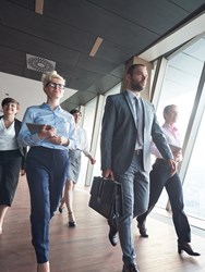 Professionals walking down a corridor