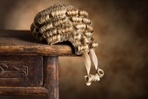 Barristers wig on a wooden desk