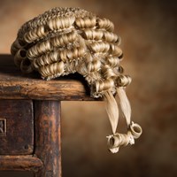 Barristers wig on a wooden desk