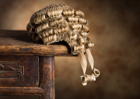 Barristers wig on a wooden desk