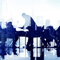 Business professionals at a meeting by a large window