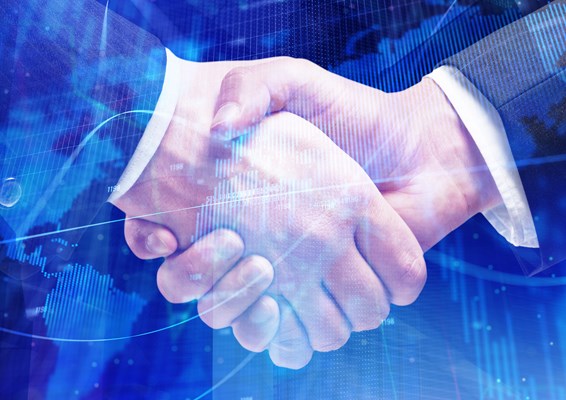 Digital map superimposed with two men shaking hands