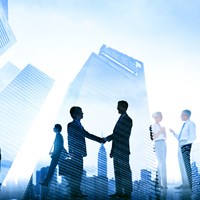 Silhouette of Law professionals shaking hands