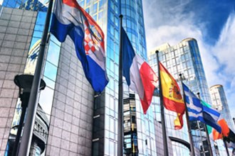 International flags in front of modern office buildings