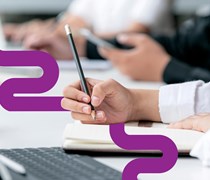 Student writing in class