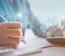 Cityscape and person working with laptop