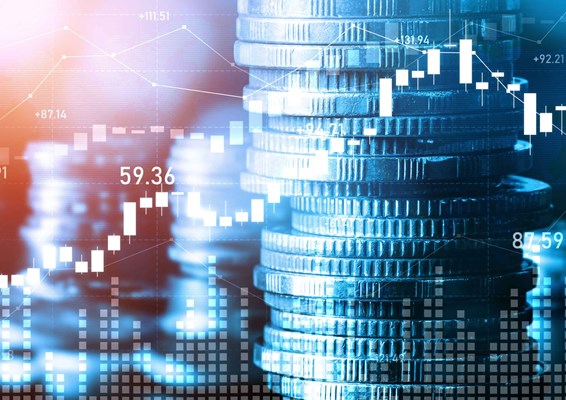Stacks of coins and financial charts