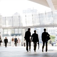Business professionals walking around modern office space