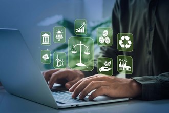 Person working on laptop overlaid with digital icons