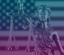 Scales of justice in front of US flag