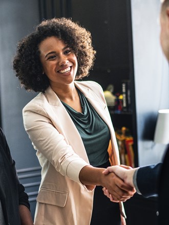 Smiling student shaking hands Smiling student shaking hands