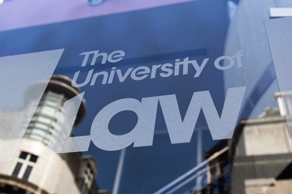 Close up The University of Law logo on Leed's campus exterior