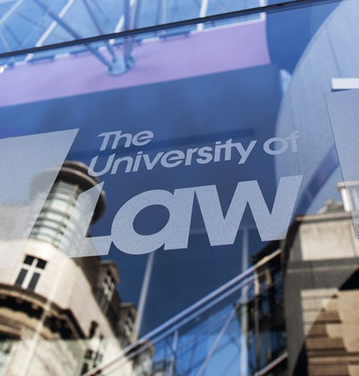 Close up ULaw logo on Leed's campus exterior