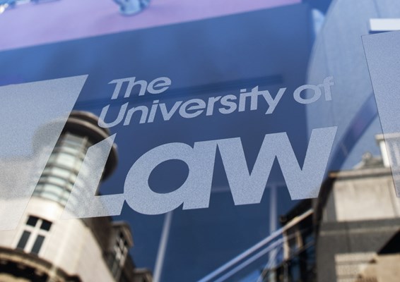 Close up ULaw logo on Leed's campus exterior
