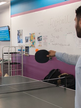 Two students playing table tennis Two students playing table tennis