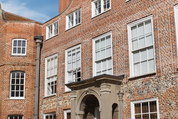 Sunny exterior of Earlham hall at the University of East Anglia