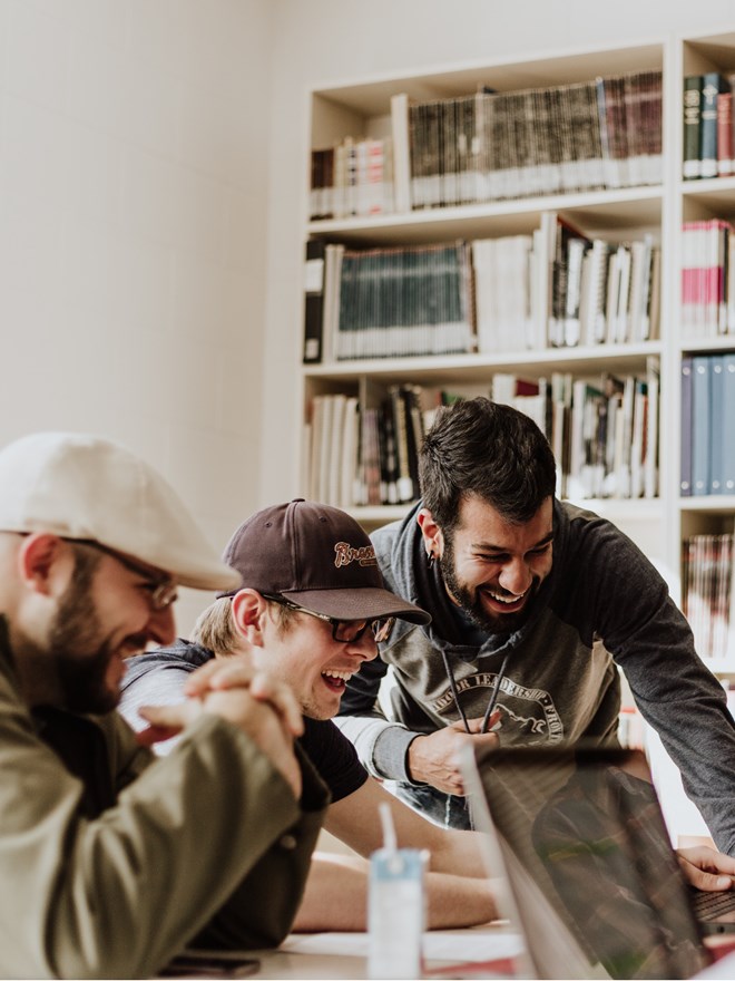 Group of males studying together Group of males studying together