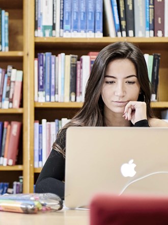 Female student studying in library