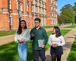 Students walking outside Royal Holloway Law School