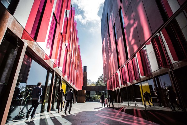 Students walking through campus buildings