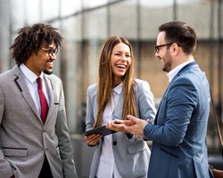 Three coworkers laughing 