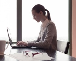 Women working on laptop in office