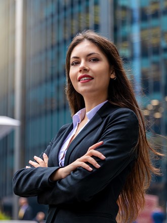 Woman cross armed in a suit