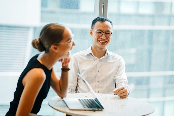 Two colleagues laughing 