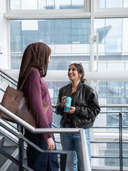 Students talking on staircase
