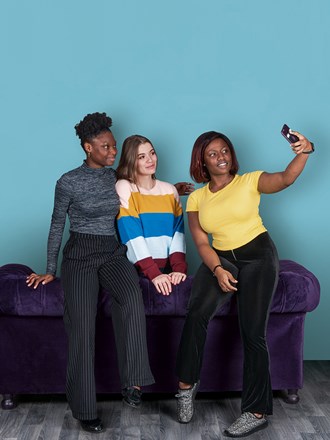 three students taking a selfie