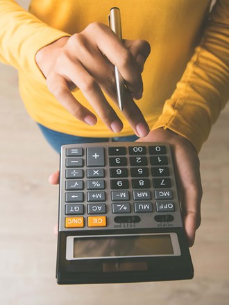 Person using calculator Person using calculator