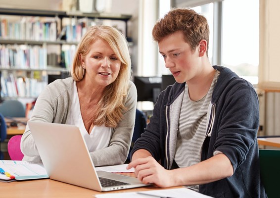Lecturer teaching a student