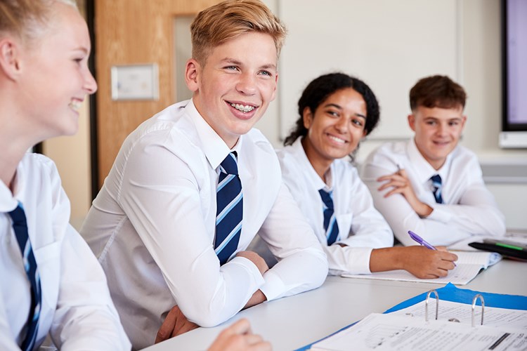 A group of secondary school students in a classroom A group of secondary school students in a classroom