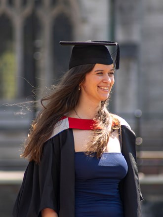 Student wearing academic dress outside