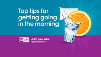 Glass of water, slice of orange and pillow next tot he text tops tips for getting going in the morning