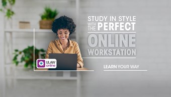 Woman studying at laptop with plants behind her