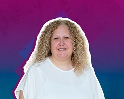 Rachel Richards is a  white woman with mid-length curly blonde hair. She is wearing a loose white top.