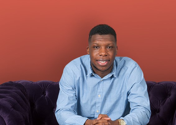 University of Law student sitting on a sofa