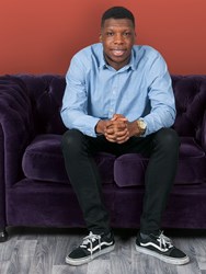 University of Law student sitting on a sofa University of Law student sitting on a sofa