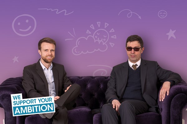 Academic and disabled student sat on a sofa Academic and disabled student sat on a sofa