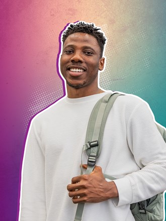 Smiling student carrying bag on their shoulder