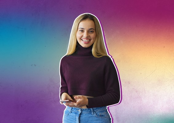 Smiling student holding mobile phone