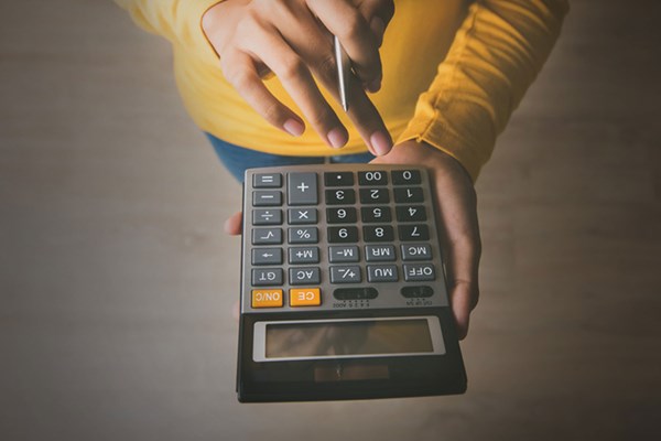Person using a calculator Person using a calculator