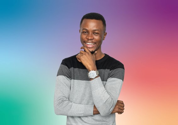 Smiling student on multicoloured background
