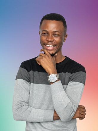 Smiling student on multicoloured background