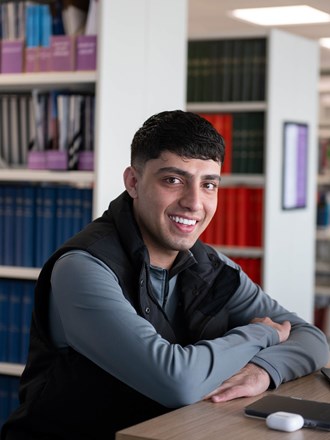 Smiling student in library