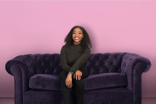 ULaw student sitting on sofa ULaw student sitting on sofa