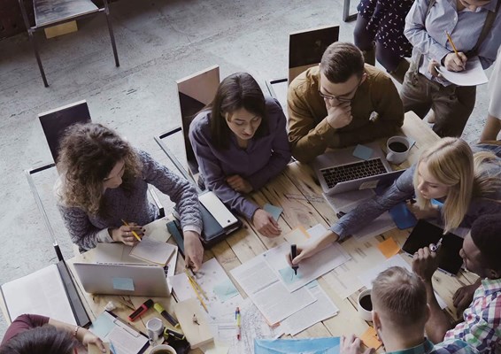 Professionals working together around a table