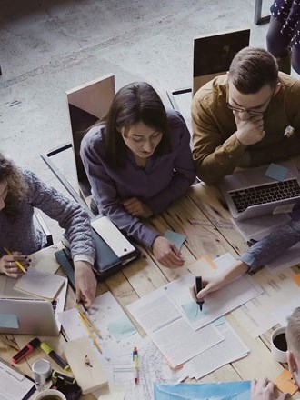 Professionals working together around a table