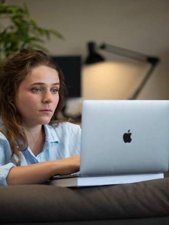 ULaw student Victoria on laptop
